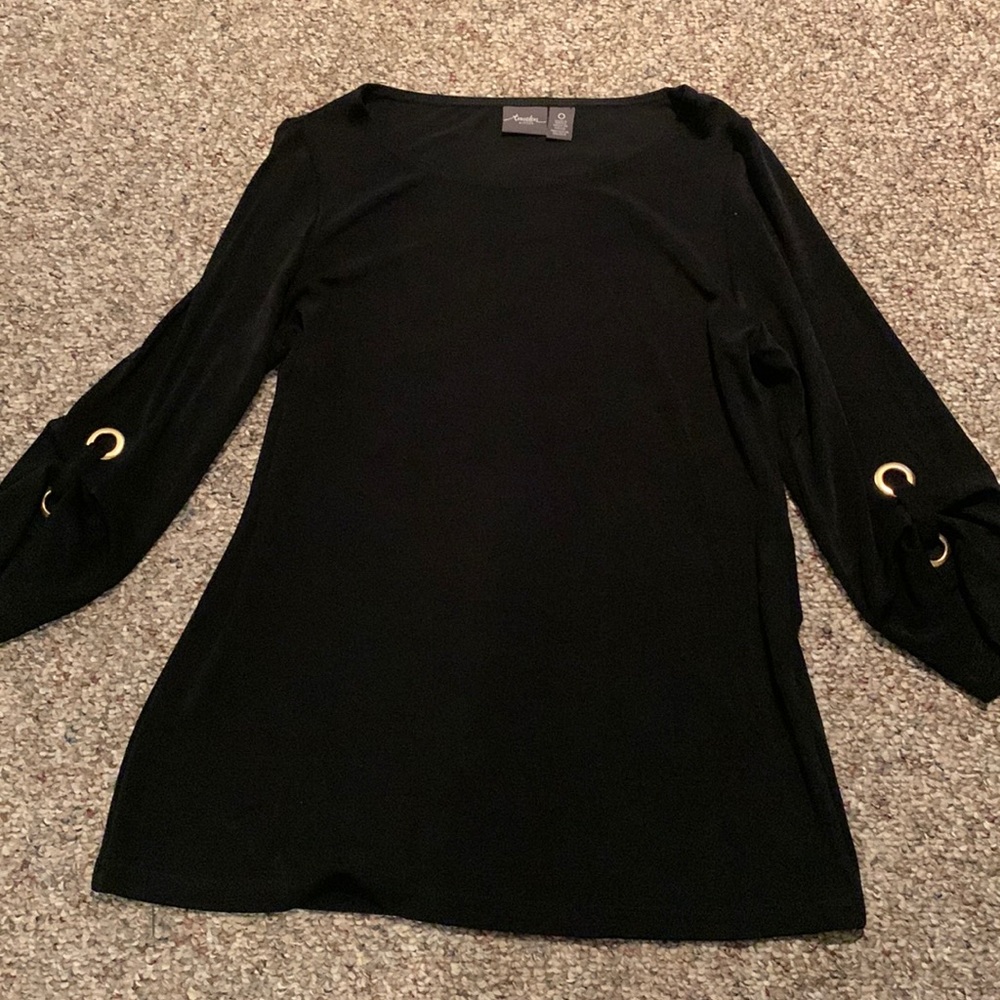 Chic’s Traveler’s slinky black top with brass rings on sleeves. Size 0